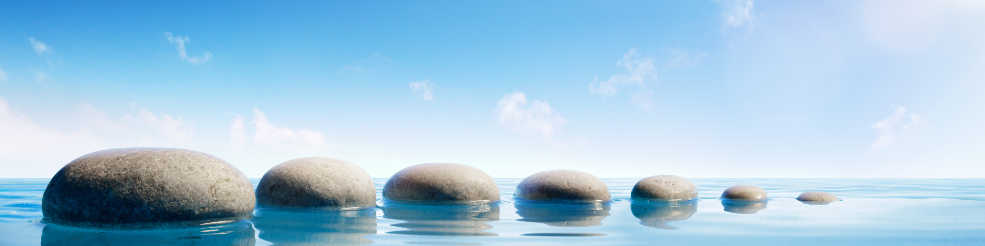 Blog banner 2000x500pxls Small stepping stones leading up to bigger stepping stones
